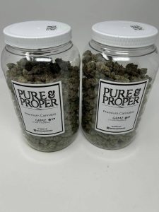 Dense, diamond-shaped emerald-green cannabis buds,