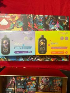 Black vape pen with a sleek design, emitting vapor